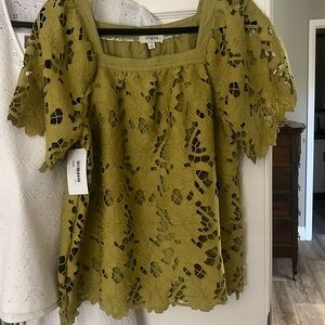 Blouse size medium new with tages cutouts lined in linen moss green